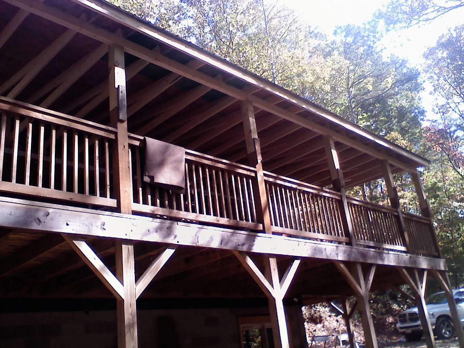 Timber framing under a new elevated porch and deck — Roof Leak Repair in North Clarendon by Roofing Brothers